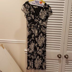 Monochrome midi  dress with underlying slip and flutter sleeves.